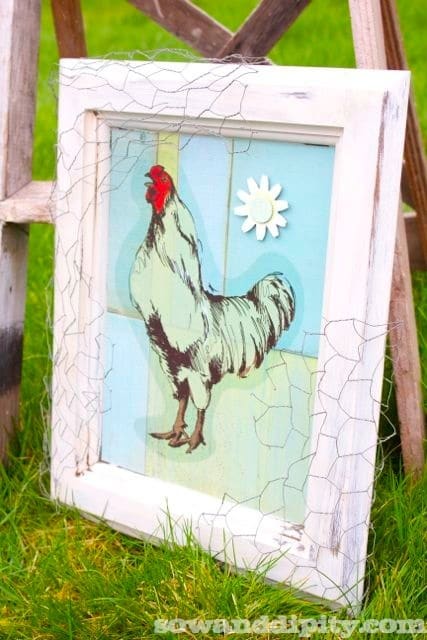 Wall art: old window frame, chicken wire, old bottles and greenery